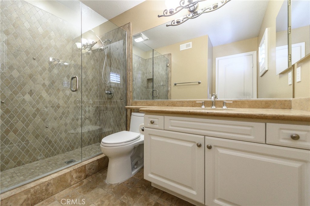 2 Bayleaf Lane Irvine, CA 92620 - Photo 35 of 40 a bathroom with a sink a toilet and shower