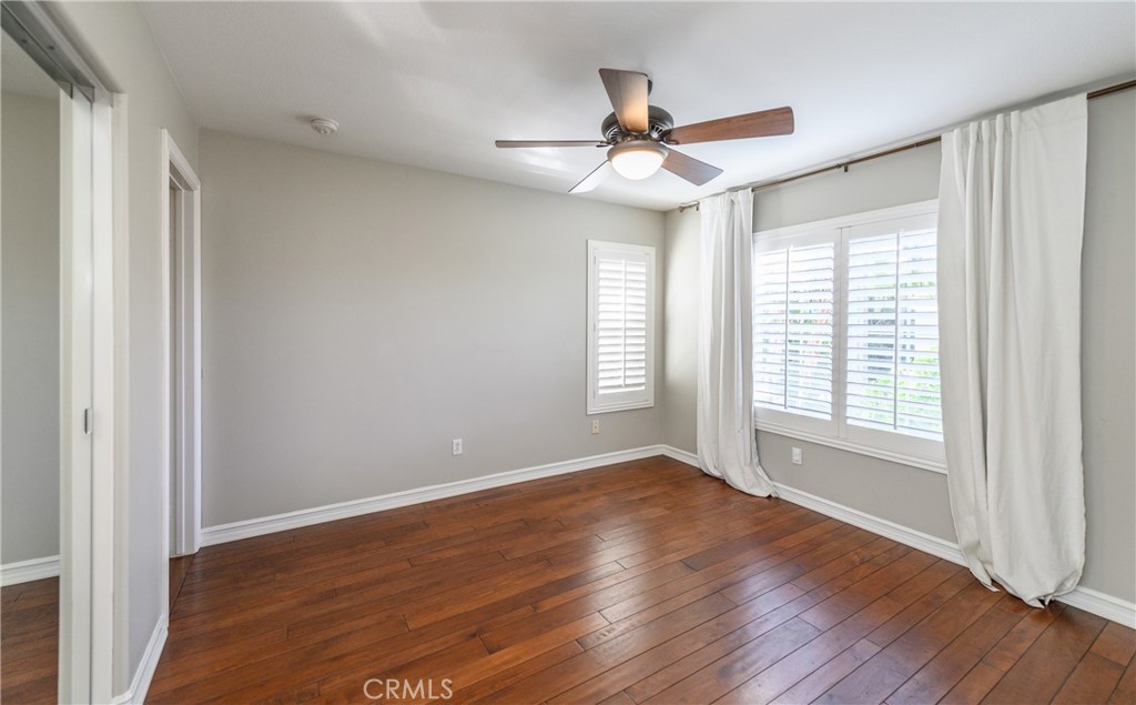 2 Bayleaf Lane Irvine, CA 92620 - Photo 36 of 40 a view of an empty room with wooden floor and a window