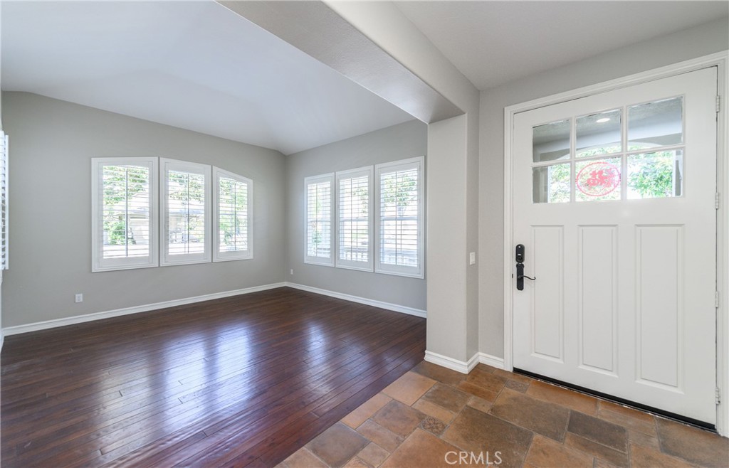 2 Bayleaf Lane Irvine, CA 92620 - Photo 7 of 40 an empty room with wooden floor and windows