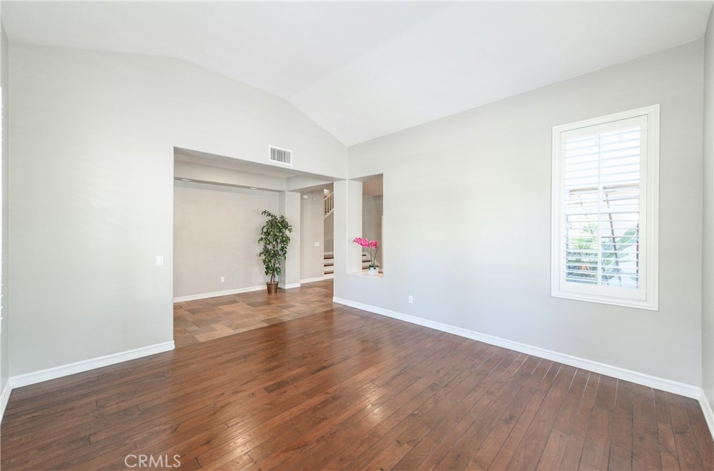 2 Bayleaf Lane Irvine, CA 92620 - Photo 10 of 40 a view of an empty room with wooden floor and a window