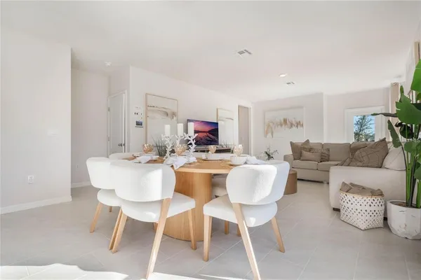 a view of a dining room with furniture and a livingroom