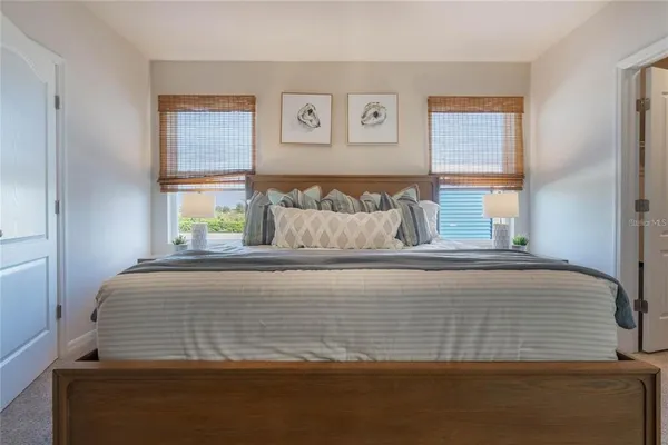 a bedroom with bed and window