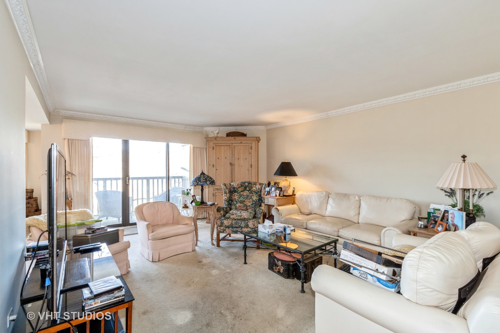 70 Cedar Ridge, Unit C Lake Barrington, IL 60010 - Photo 3 of 18 a living room with furniture and a large window