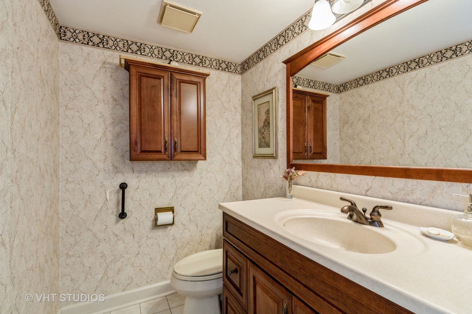 70 Cedar Ridge, Unit C Lake Barrington, IL 60010 - Photo 9 of 18 a bathroom with a sink and a toilet