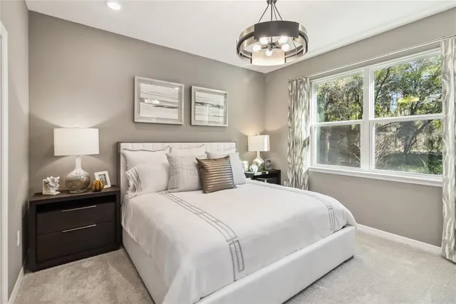 a bedroom with bed and window