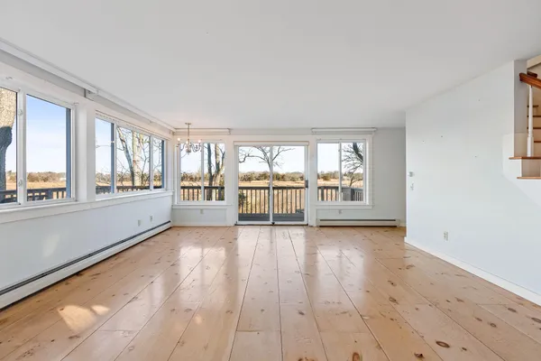 a view of an empty room with a window