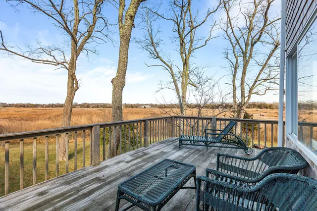 a view of a yard with wooden fence