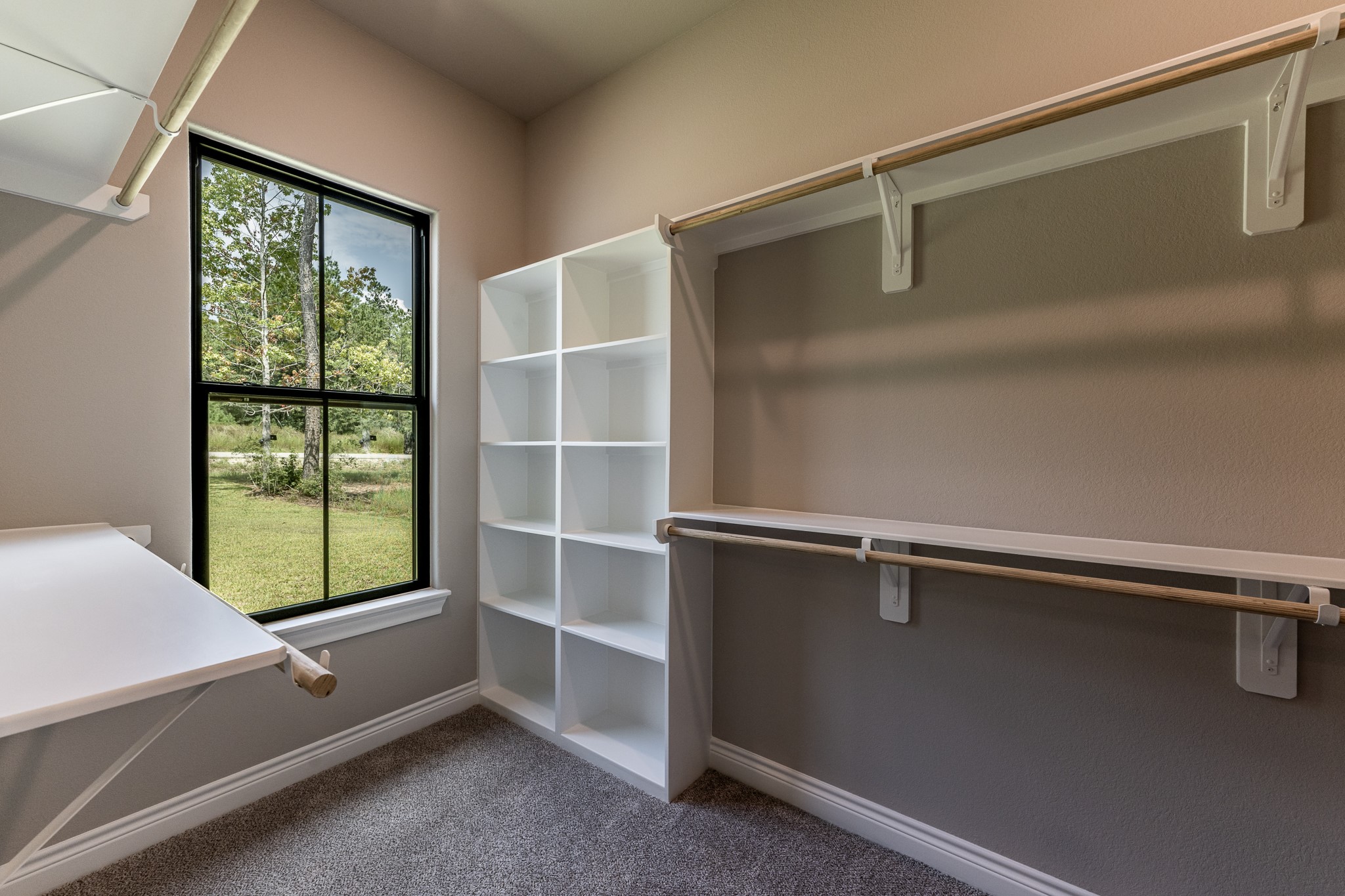 111 Eagle Run Road Willis, TX 77378 - Photo 39 of 44 Spacious walk-in closet with ample shelving and natural light, perfect for organizing your wardrobe.