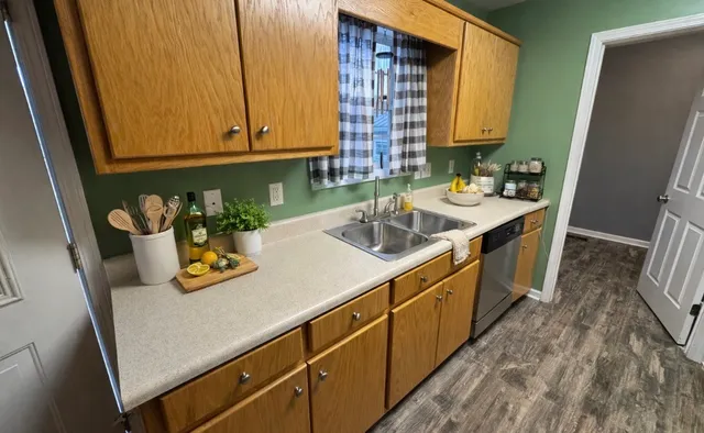 a kitchen with sink and cabinets