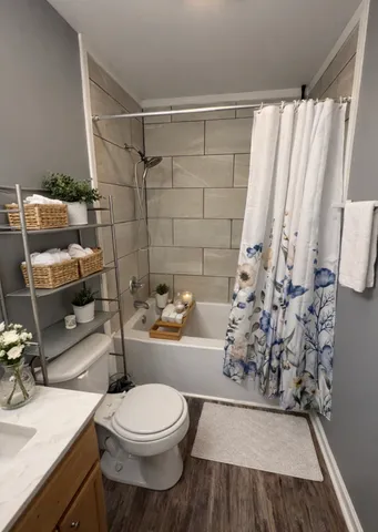 a bathroom with a toilet and shower