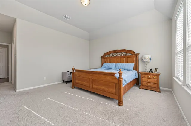 a bathroom with a tub a sink and mirrors