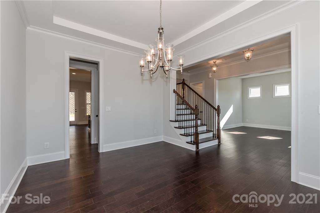 4006 Oarman Court, Unit 440 Fort Mill, SC 29708 - Photo 3 of 15 a view of a hallway with wooden floor and staircase