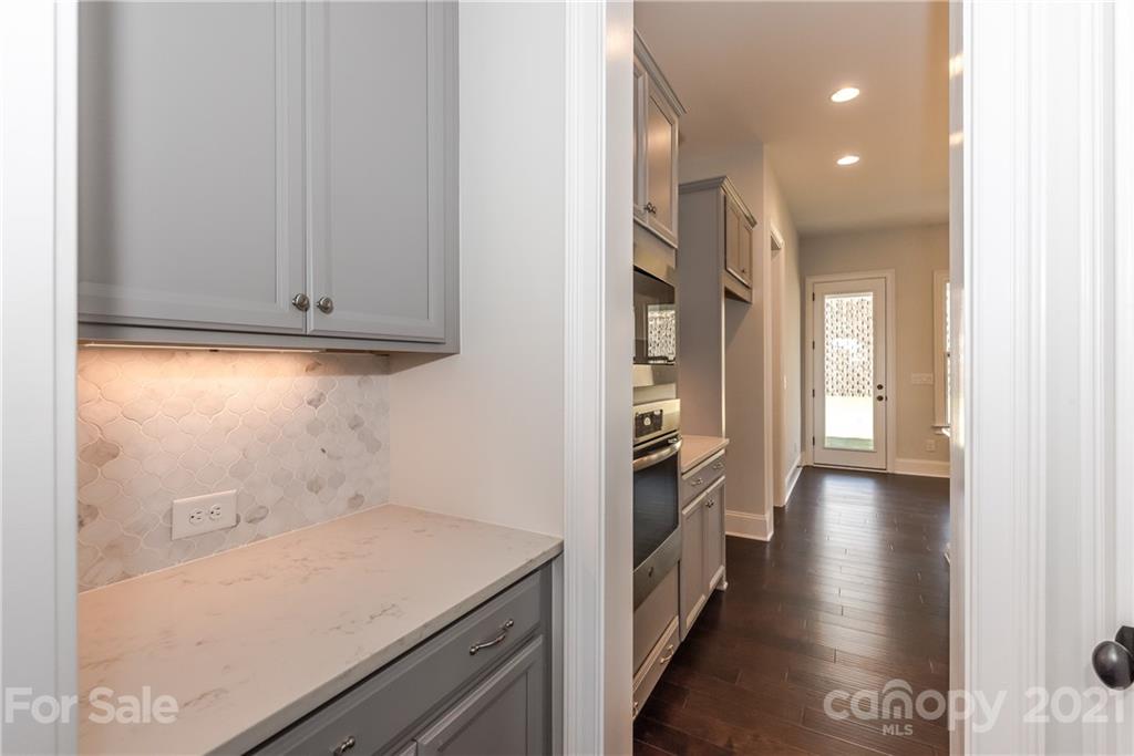 4006 Oarman Court, Unit 440 Fort Mill, SC 29708 - Photo 4 of 15 a view of a hallway with wooden floor