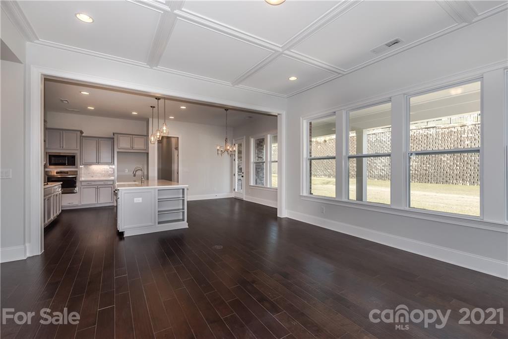 4006 Oarman Court, Unit 440 Fort Mill, SC 29708 - Photo 8 of 15 a living room with hardwood flooring and a kitchen view