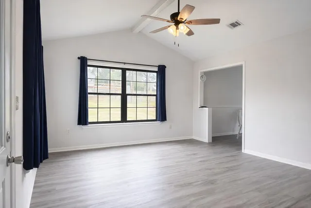 a view of room window and wooden floor