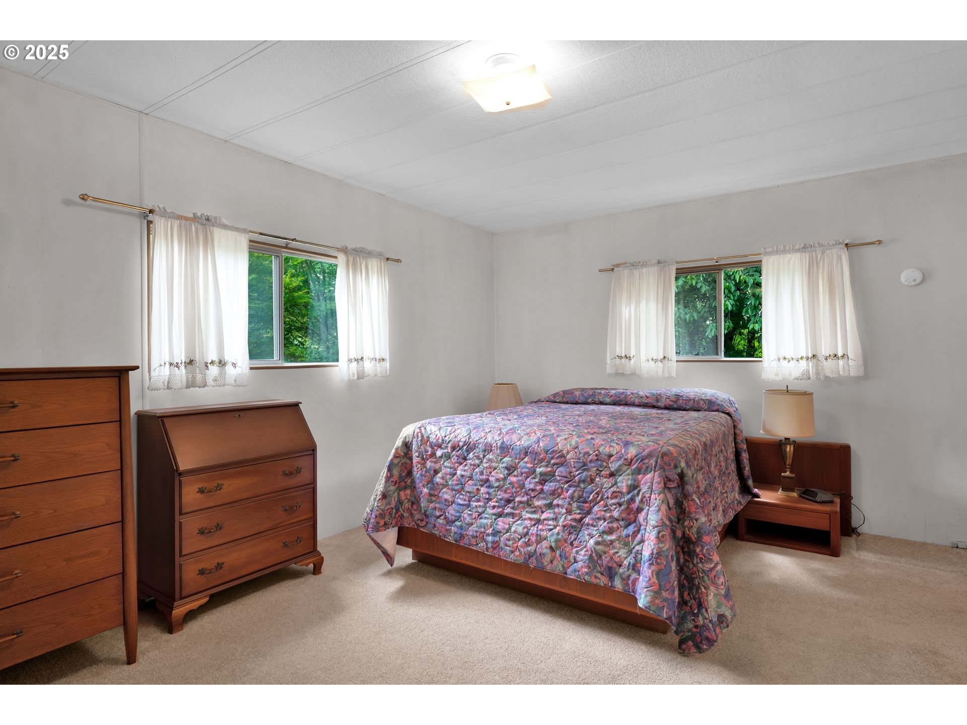 10273 Sweet Creek Road Mapleton, OR 97453 - Photo 17 of 48 a bedroom with a bed and a dresser