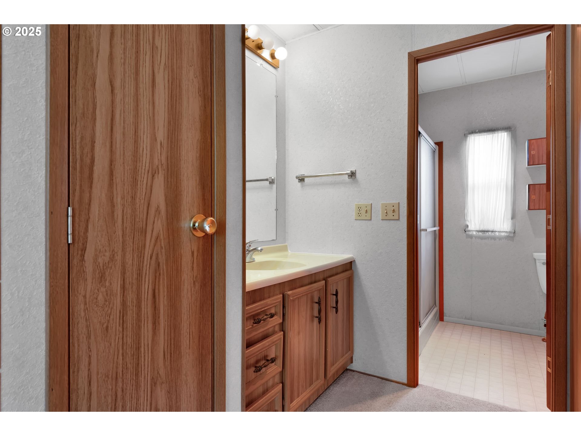 10273 Sweet Creek Road Mapleton, OR 97453 - Photo 19 of 48 a bathroom with a sink a mirror and a shower