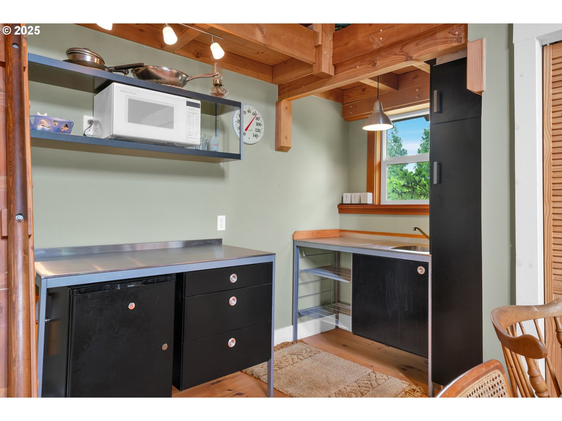 10273 Sweet Creek Road Mapleton, OR 97453 - Photo 27 of 48 a kitchen with a sink and cabinets
