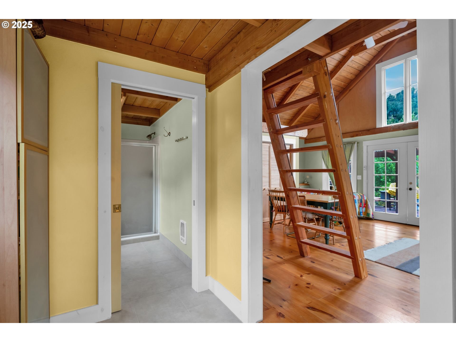 10273 Sweet Creek Road Mapleton, OR 97453 - Photo 30 of 48 a view of a hallway with a dining table and chairs