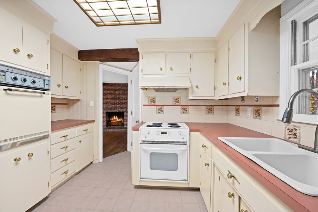 1 Maynard Street Northborough, MA 01532 - Photo 11 of 41 a kitchen with granite countertop a sink stainless steel appliances and cabinets