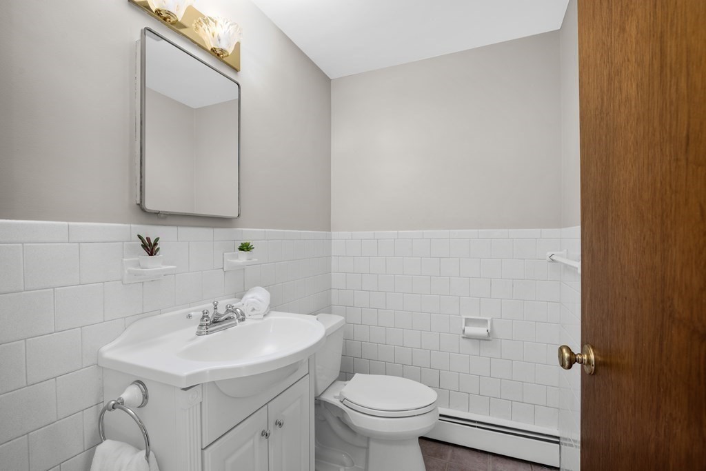 1 Maynard Street Northborough, MA 01532 - Photo 16 of 41 a bathroom with a sink toilet and a mirror