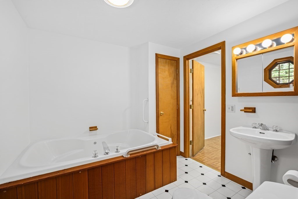 1 Maynard Street Northborough, MA 01532 - Photo 24 of 41 a bathroom with a sink and a mirror