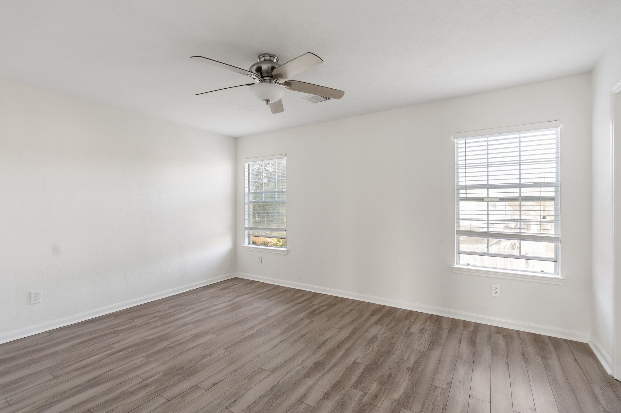 18102 Clayton Bluff Lane Cypress, TX 77433 - Photo 20 of 30 wooden floor in an empty room with a window