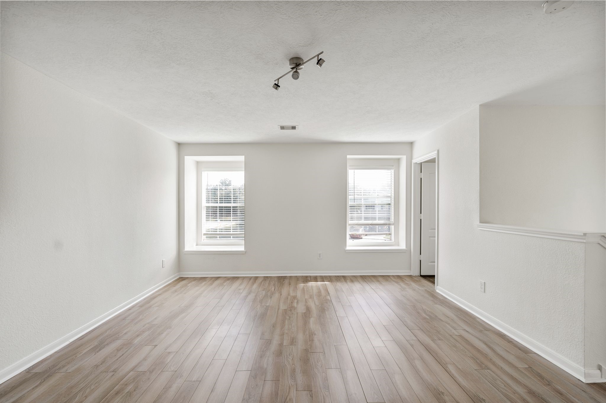 18102 Clayton Bluff Lane Cypress, TX 77433 - Photo 27 of 30 a view of an empty room with a window and wooden floor