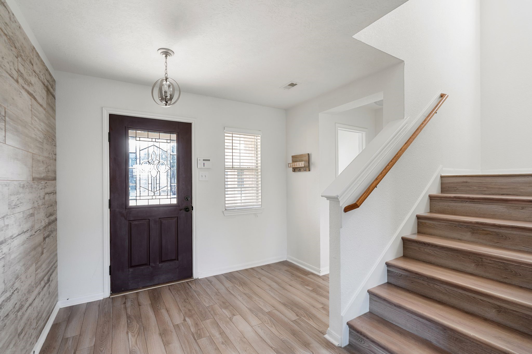 18102 Clayton Bluff Lane Cypress, TX 77433 - Photo 6 of 30 a view of an entryway with wooden floor