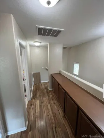 a hallway with wooden floor