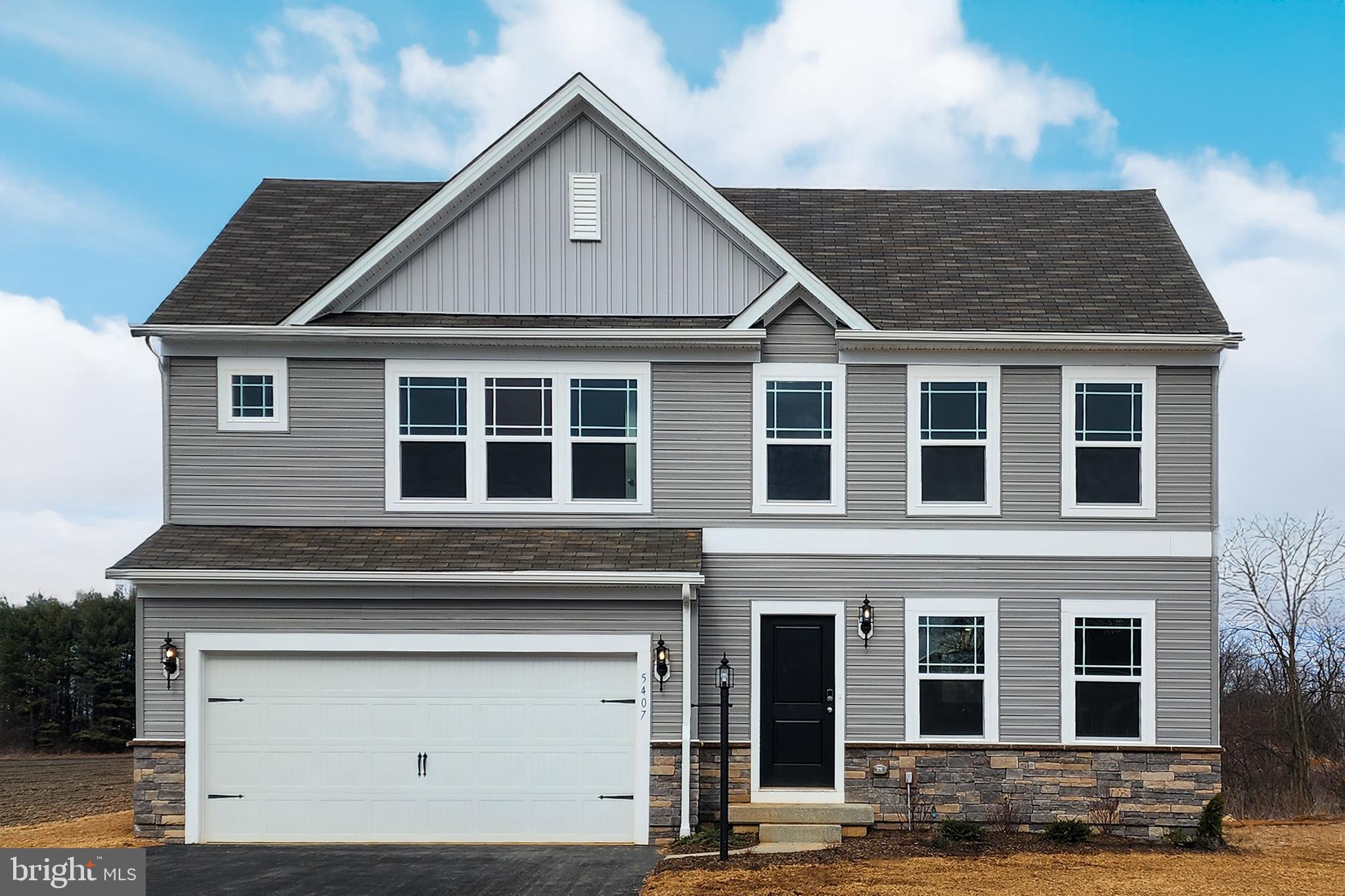 5407 Harrier Way Waynesboro, PA 17268 - Photo 1 of 35 a front view of a house with a garage