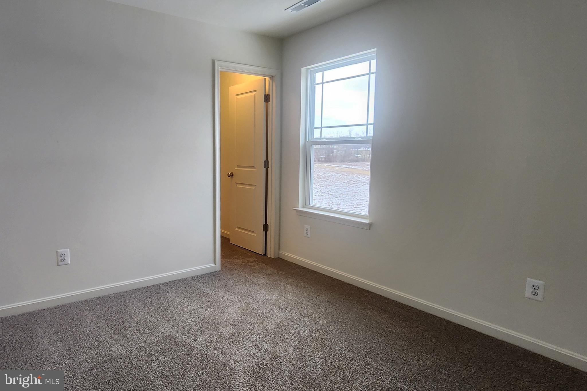 5407 Harrier Way Waynesboro, PA 17268 - Photo 11 of 35 an empty room with windows and closet