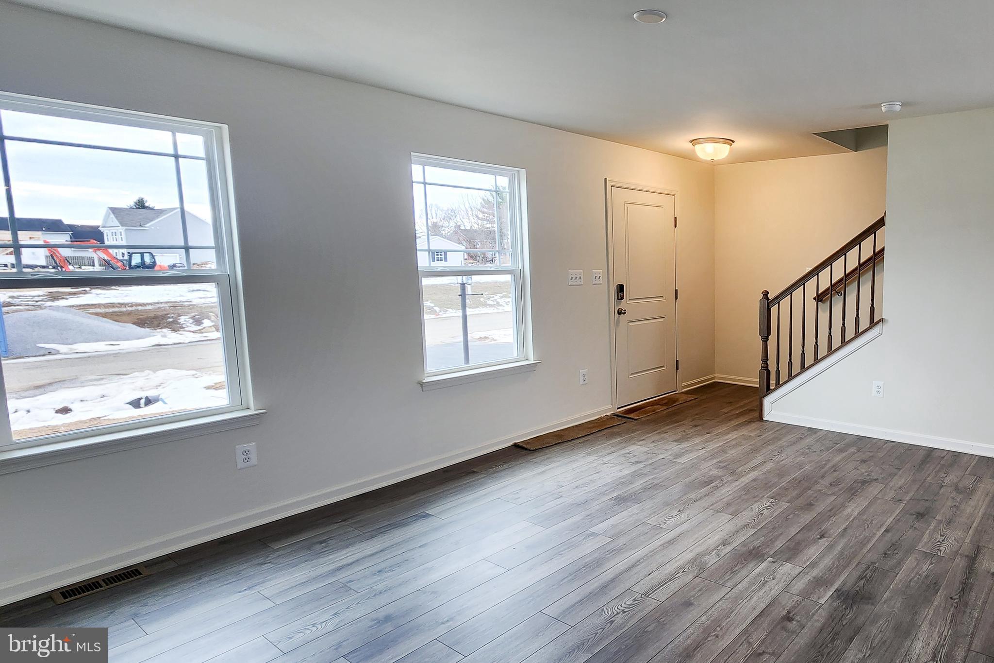 5407 Harrier Way Waynesboro, PA 17268 - Photo 17 of 35 a view of an empty room with wooden floor and a window
