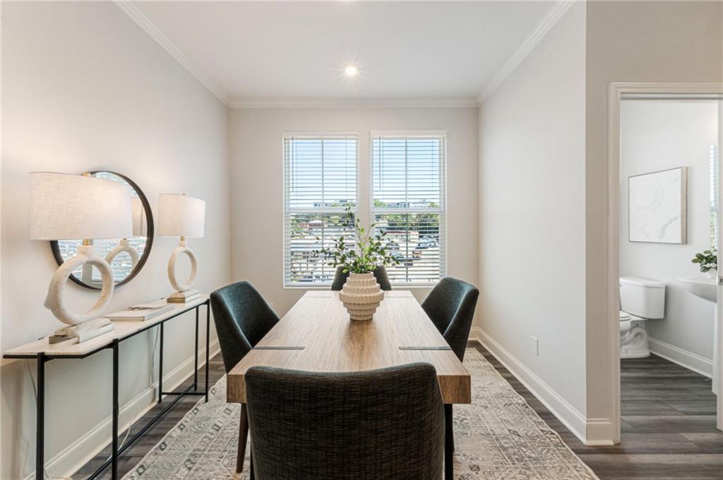 1201 Skylar Lane Southeast Atlanta, GA 30315 - Photo 13 of 37 a view of a dining room with furniture window and wooden floor