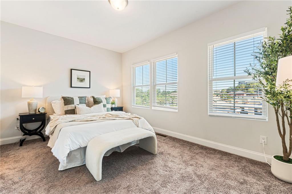 1201 Skylar Lane Southeast Atlanta, GA 30315 - Photo 16 of 37 a bed room with a bed and a window