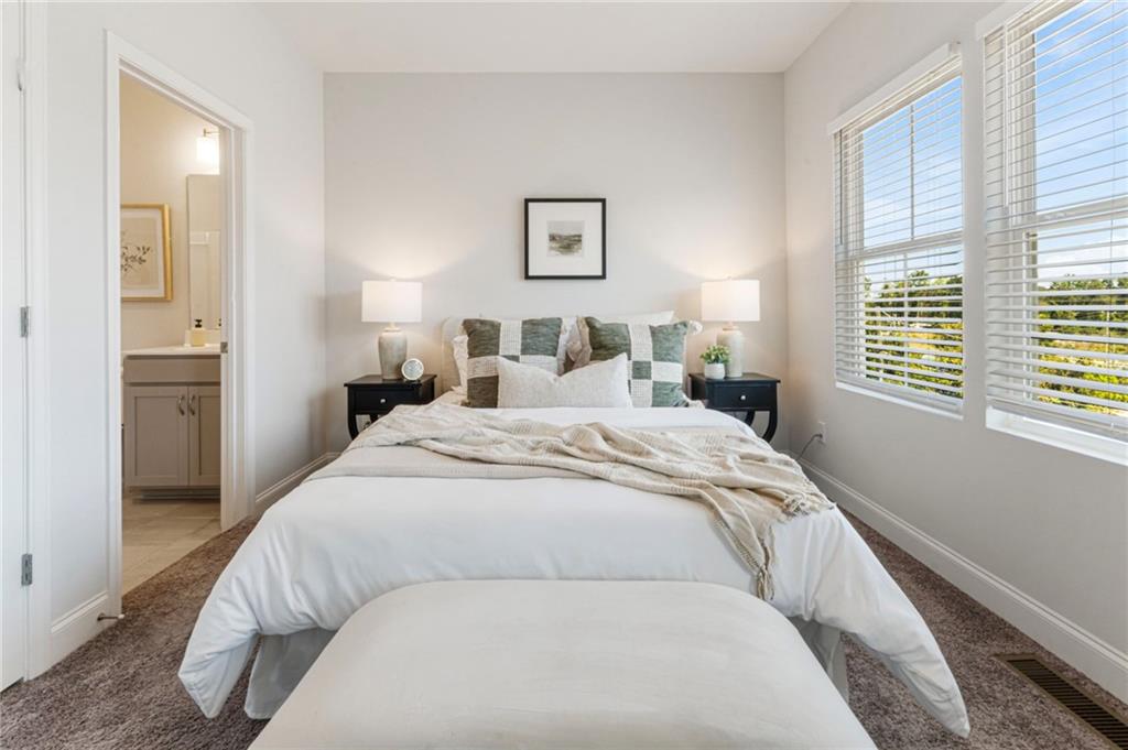 1201 Skylar Lane Southeast Atlanta, GA 30315 - Photo 17 of 37 a bedroom with a bed and a window