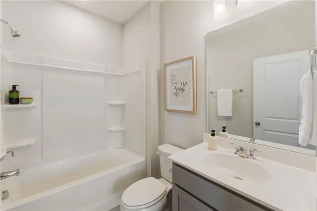 a en suite bathroom with a sink and a mirror