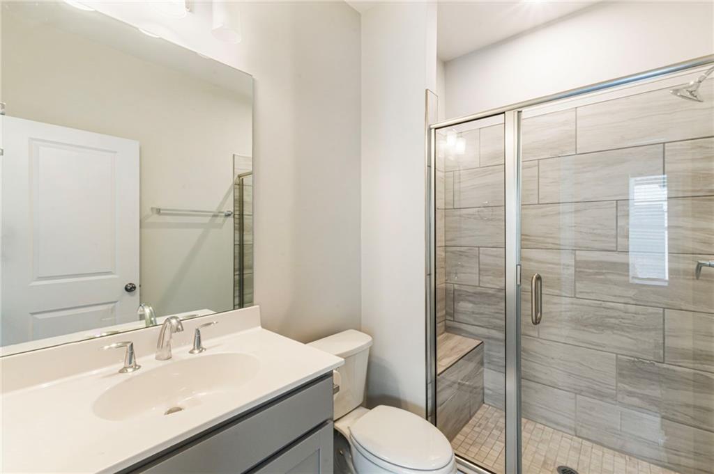 1201 Skylar Lane Southeast Atlanta, GA 30315 - Photo 24 of 37 a bathroom with a sink toilet and shower