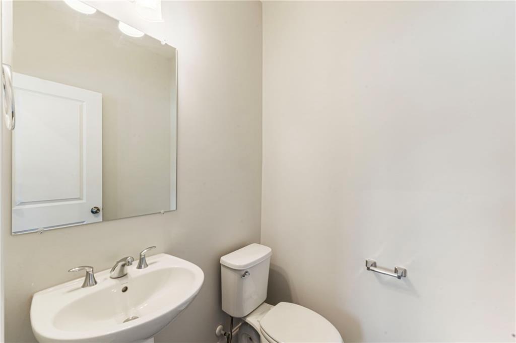 1201 Skylar Lane Southeast Atlanta, GA 30315 - Photo 28 of 37 a bathroom with a sink mirror and toilet