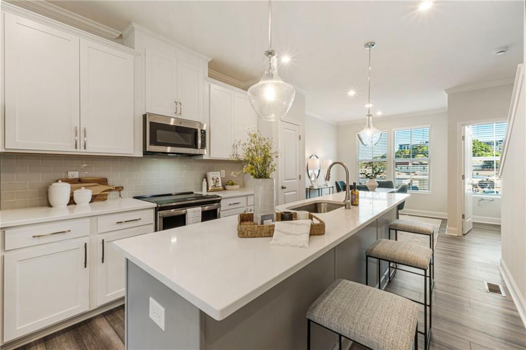 1201 Skylar Lane Southeast Atlanta, GA 30315 - Photo 9 of 37 a kitchen with a sink a stove and cabinets