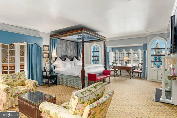 a spacious bathroom with a double vanity sink a large mirror and a shower