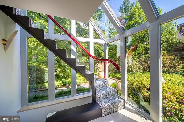 a bathroom with a granite countertop toilet and a sink