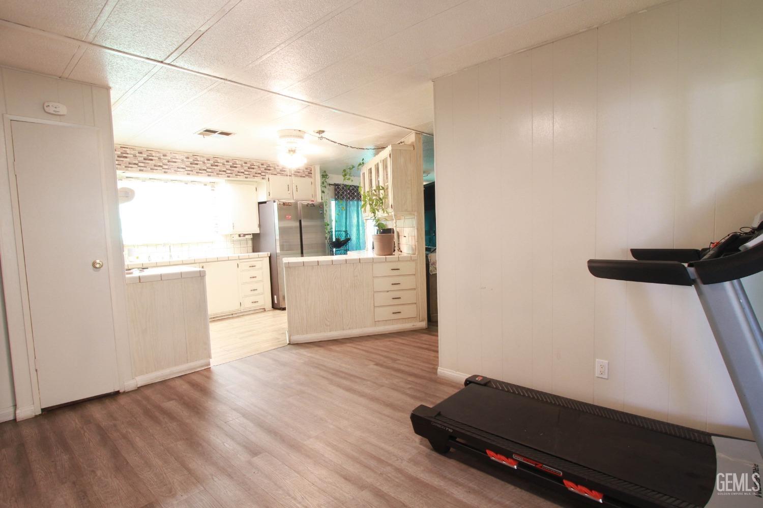 Undisclosed Address Bakersfield, CA 93304 - Photo 13 of 27 a view of an empty room with a window