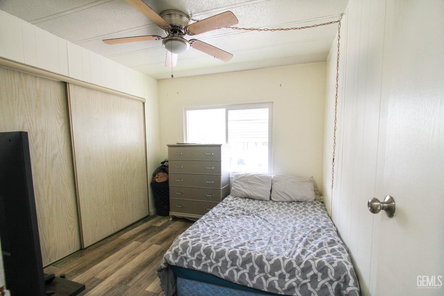 Undisclosed Address Bakersfield, CA 93304 - Photo 20 of 27 a bedroom with a bed and a walk in closet