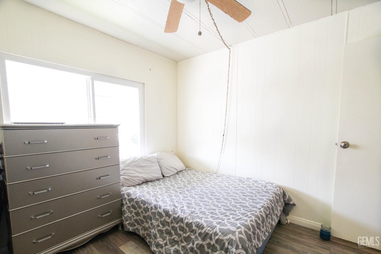 Undisclosed Address Bakersfield, CA 93304 - Photo 21 of 27 a bedroom with a bed and a window