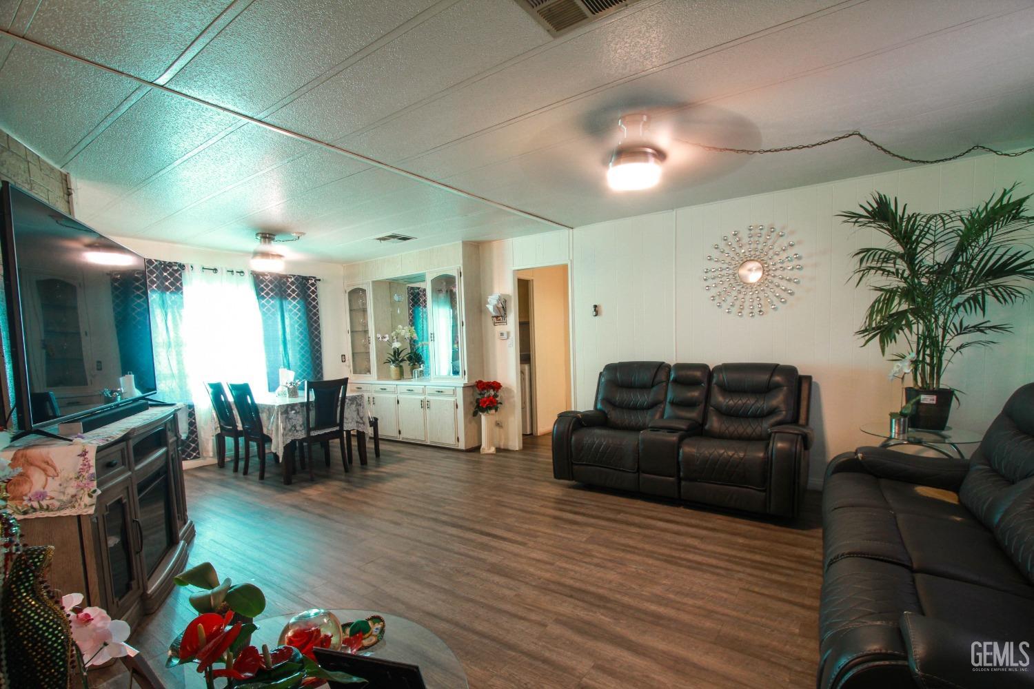 Undisclosed Address Bakersfield, CA 93304 - Photo 5 of 27 a living room with furniture and a couch