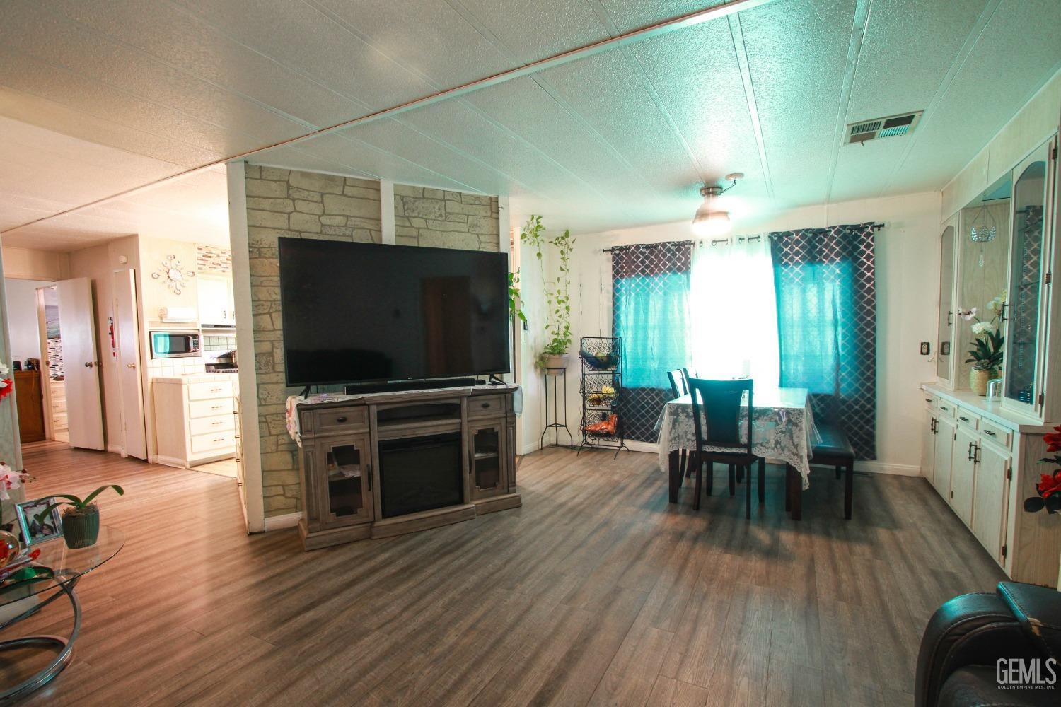 Undisclosed Address Bakersfield, CA 93304 - Photo 6 of 27 a view of a livingroom with furniture and a flat screen tv