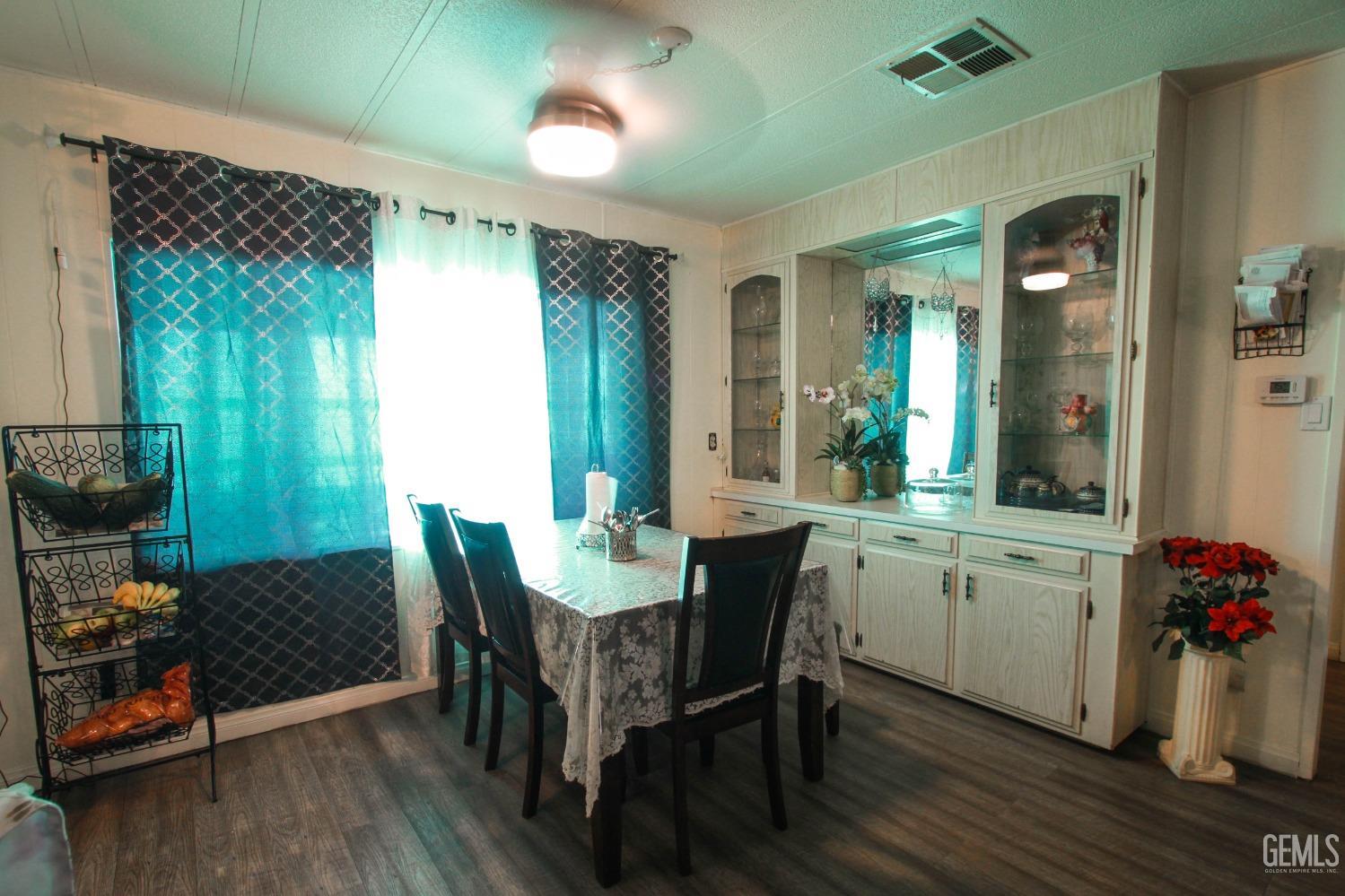 Undisclosed Address Bakersfield, CA 93304 - Photo 7 of 27 a view of a dining room with furniture and chandelier