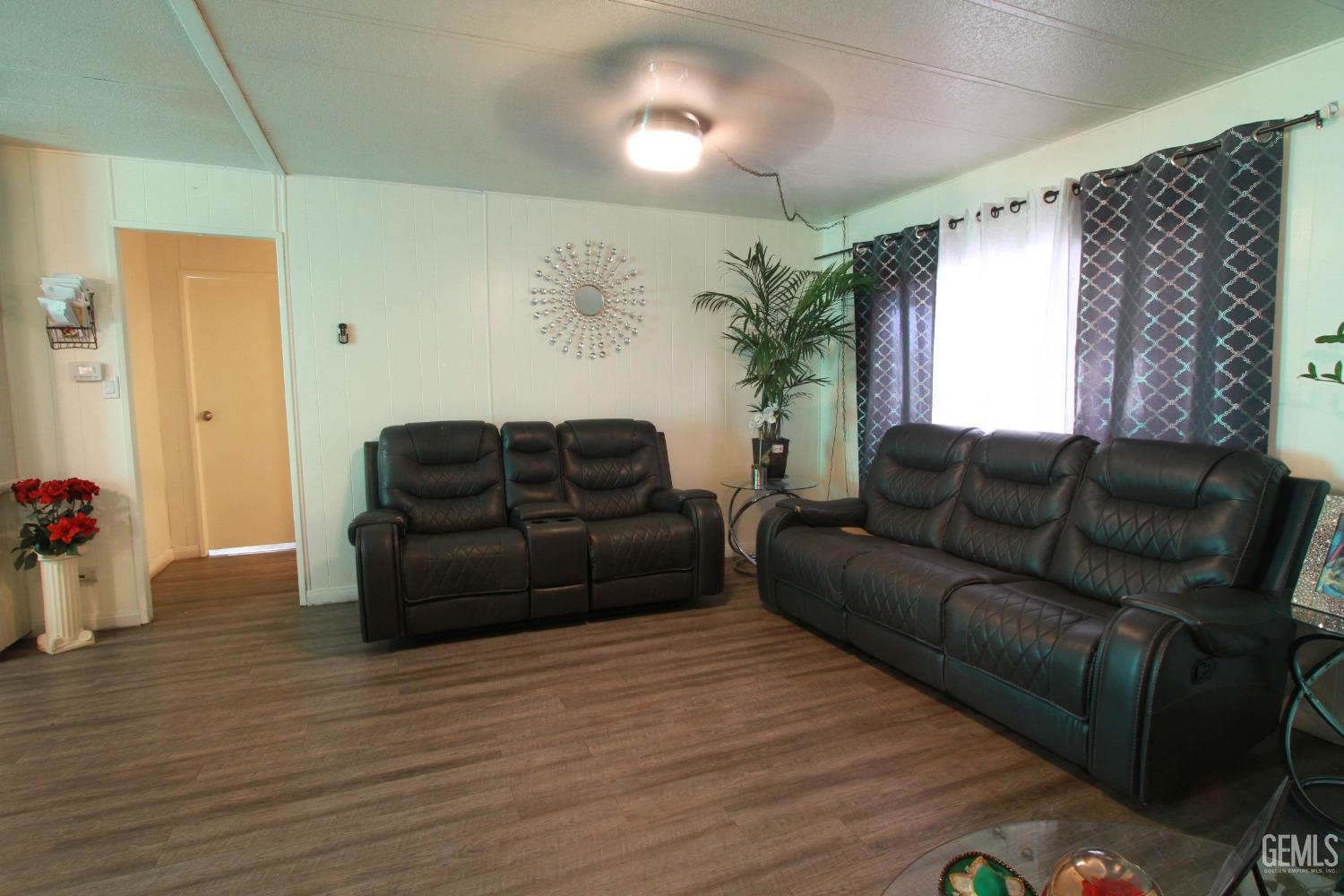 Undisclosed Address Bakersfield, CA 93304 - Photo 8 of 27 a living room with furniture