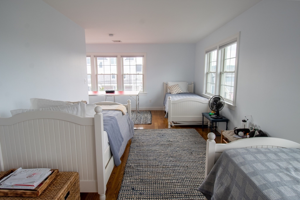 117 River Street Scituate, MA 02050 - Photo 11 of 23 a bedroom with a bed and wooden floor
